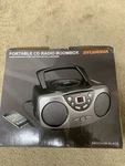 Sylvania Portable Radio Boombox & Aux In SRCD243 - Black. Fixed Price $50.00.